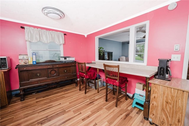 interior space featuring ornamental molding and wood finished floors