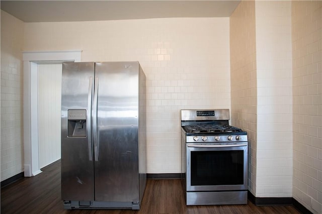 1211 Main St, Aliquippa, PA 15001 - kitchen with baseboards, stainless steel appliances, dark wood-style flooring, and tile walls