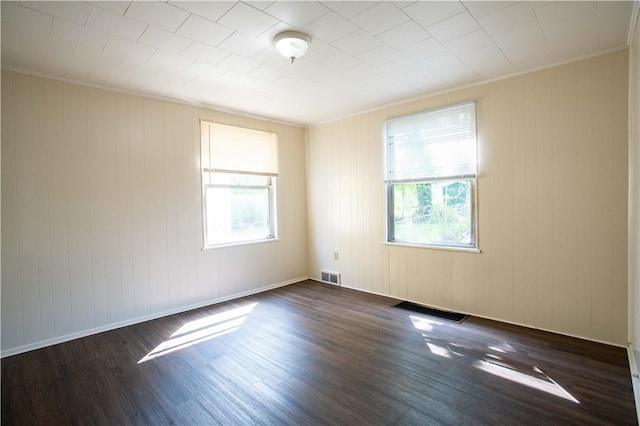 1211 Main St, Aliquippa, PA 15001 - empty room featuring visible vents, a wealth of natural light, and dark wood-style floors
