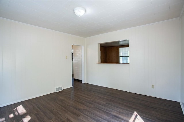1211 Main St, Aliquippa, PA 15001 - spare room with visible vents, crown molding, and dark wood-type flooring