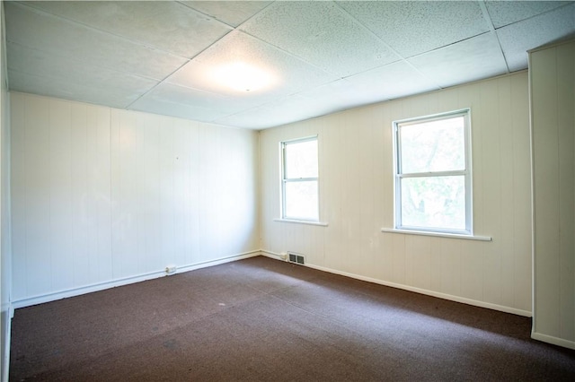 1211 Main St, Aliquippa, PA 15001 - unfurnished room with visible vents, dark carpet, and a drop ceiling