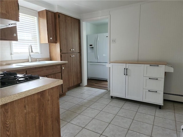 525 E Old Lincoln Hwy, Ligonier Twp, PA 15658 - kitchen featuring white refrigerator with ice dispenser, light countertops, white cabinets, a sink, and light tile patterned floors
