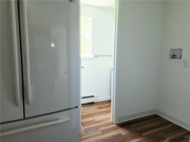 525 E Old Lincoln Hwy, Ligonier Twp, PA 15658 - clothes washing area featuring baseboards, a baseboard heating unit, hookup for a washing machine, and wood finished floors