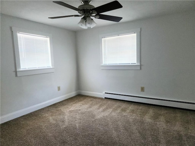 525 E Old Lincoln Hwy, Ligonier Twp, PA 15658 - unfurnished room featuring baseboards, a healthy amount of sunlight, baseboard heating, and carpet