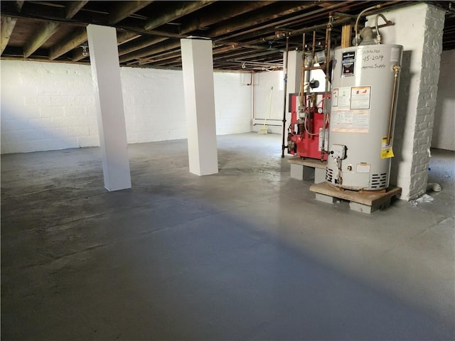 525 E Old Lincoln Hwy, Ligonier Twp, PA 15658 - unfinished basement with a heating unit, gas water heater, and concrete block wall
