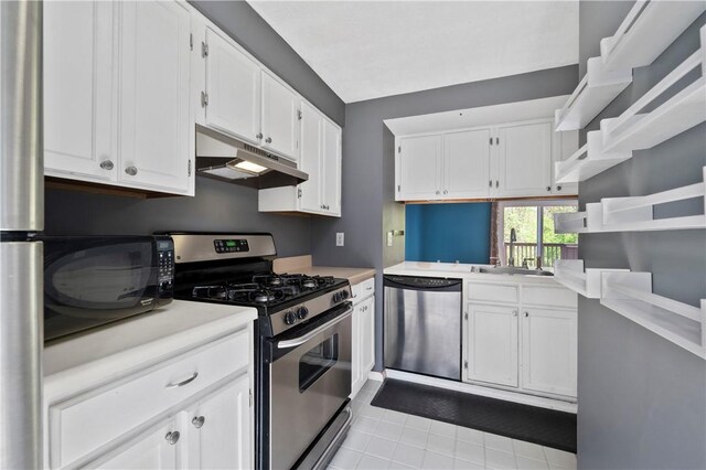 6326 Springhouse Pl, South Fayette, PA 15017 - kitchen featuring open shelves, light countertops, under cabinet range hood, a sink, and stainless steel appliances