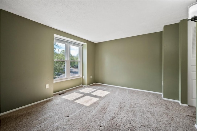 6326 Springhouse Pl, South Fayette, PA 15017 - spare room with baseboards, visible vents, and carpet