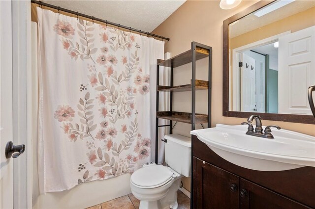 6326 Springhouse Pl, South Fayette, PA 15017 - full bathroom with vanity, tile patterned flooring, shower / bath combo with shower curtain, toilet, and a textured ceiling