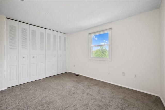 6326 Springhouse Pl, South Fayette, PA 15017 - unfurnished bedroom with baseboards, carpet, visible vents, and a closet