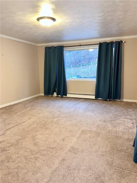 carpeted empty room with crown molding, baseboards, and a baseboard heating unit