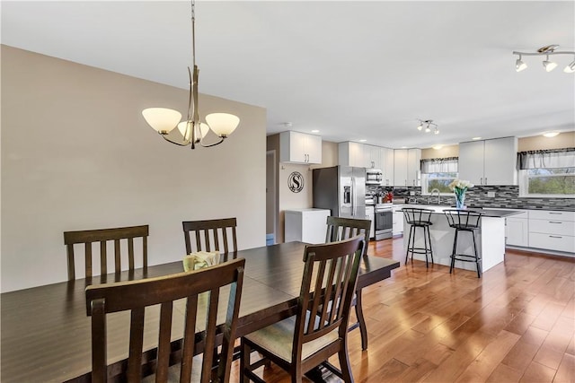 dining room featuring a chandelier and wood finished floors