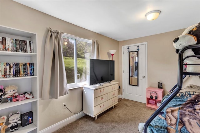 carpeted bedroom featuring baseboards