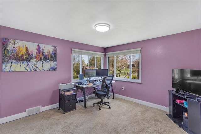 home office with visible vents, baseboards, and carpet floors