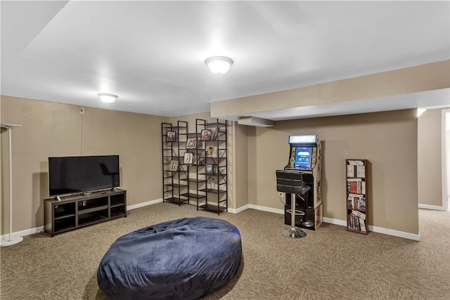 living area featuring baseboards and carpet