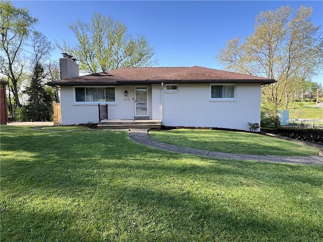 4402 Gateway Dr, Monroeville, PA 15146 - ranch-style house with a chimney, brick siding, and a front yard
