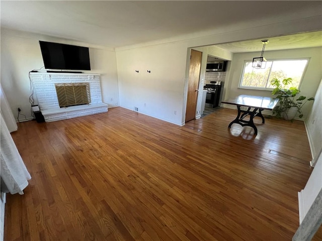 4402 Gateway Dr, Monroeville, PA 15146 - unfurnished living room featuring wood finished floors and a fireplace