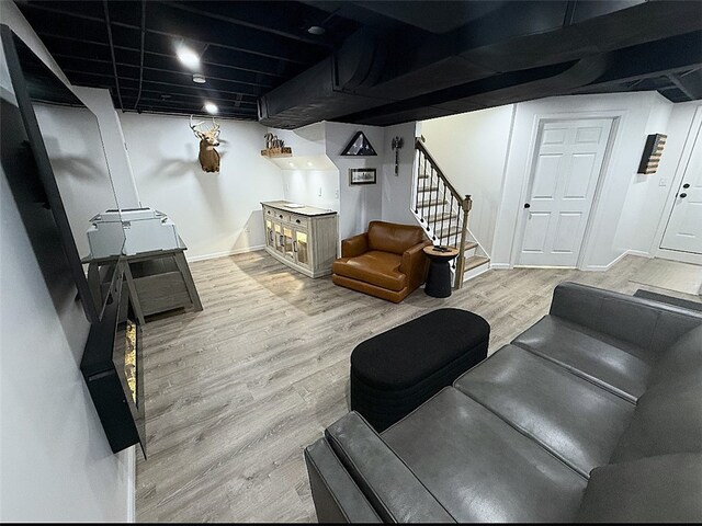 4402 Gateway Dr, Monroeville, PA 15146 - living area with baseboards, stairway, and light wood-style floors