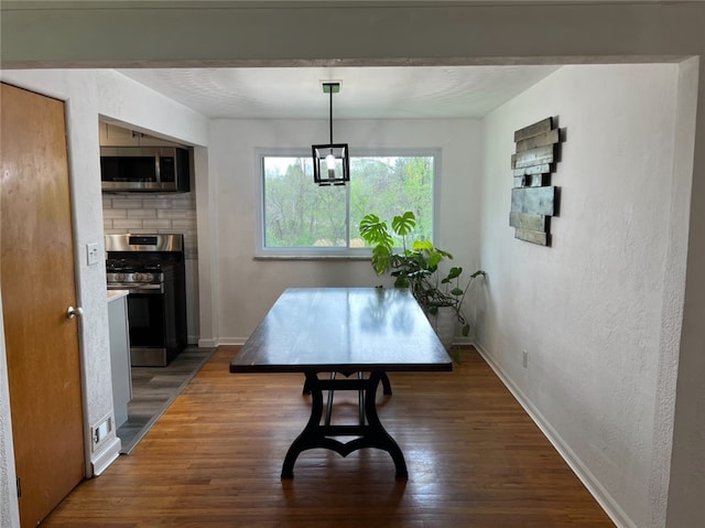4402 Gateway Dr, Monroeville, PA 15146 - dining space featuring baseboards and wood finished floors
