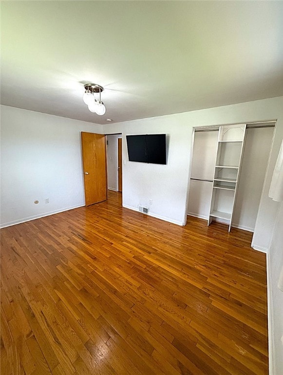 4402 Gateway Dr, Monroeville, PA 15146 - unfurnished bedroom featuring baseboards, visible vents, and hardwood / wood-style flooring