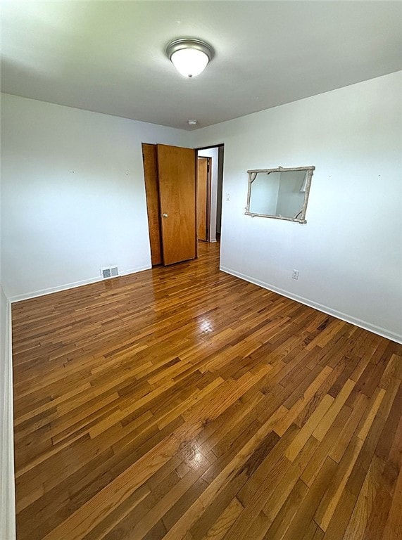 4402 Gateway Dr, Monroeville, PA 15146 - spare room featuring visible vents, baseboards, and dark wood-style floors