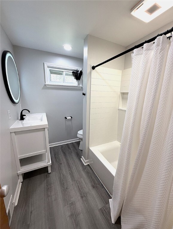 4402 Gateway Dr, Monroeville, PA 15146 - bathroom with visible vents, vanity, wood finished floors, toilet, and baseboards
