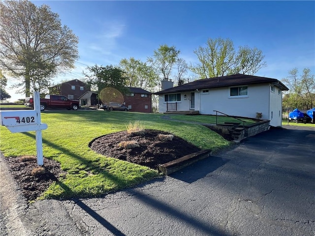 4402 Gateway Dr, Monroeville, PA 15146 - view of front of house with a chimney and a front yard