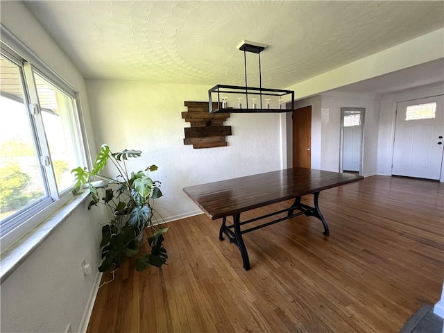 4402 Gateway Dr, Monroeville, PA 15146 - dining space with baseboards, an inviting chandelier, and wood finished floors