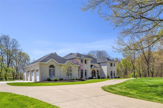 118 Lakeland Dr, Adams Twp, PA 16046 - view of front of property featuring a garage, driveway, and a front lawn