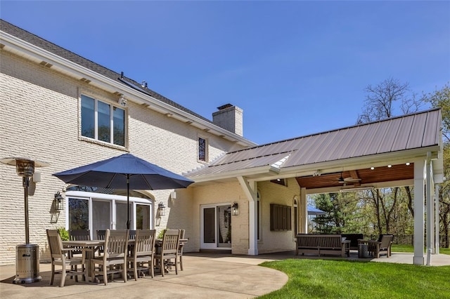 118 Lakeland Dr, Adams Twp, PA 16046 - back of house featuring brick siding, ceiling fan, a chimney, and a patio