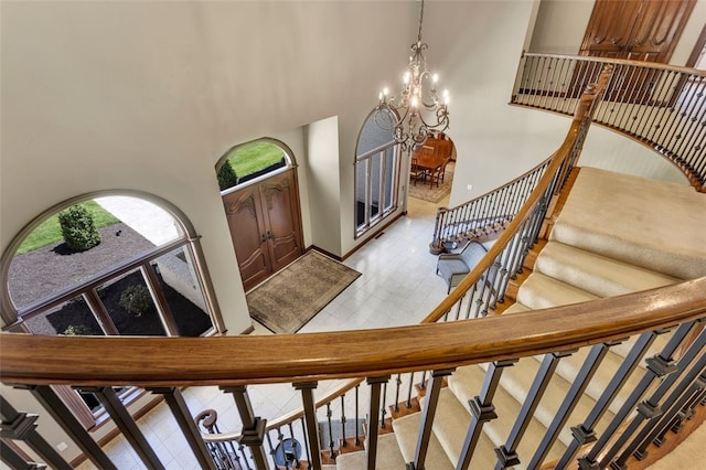 118 Lakeland Dr, Adams Twp, PA 16046 - entryway featuring stairs, an inviting chandelier, and a towering ceiling