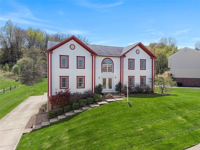 view of front of house featuring french doors and a front yard