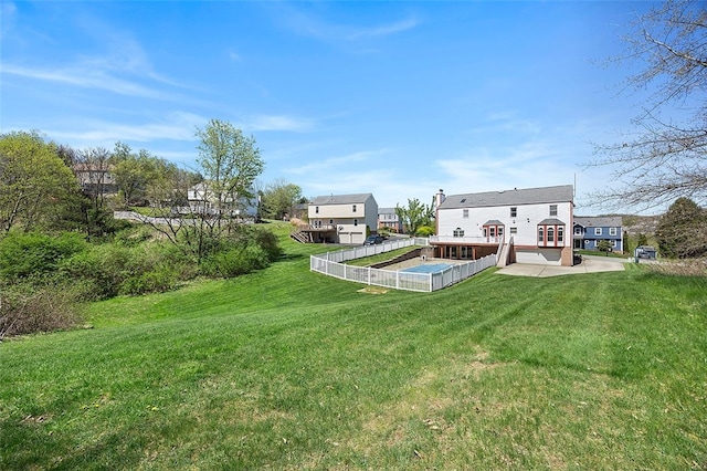 back of house featuring a yard and a patio area