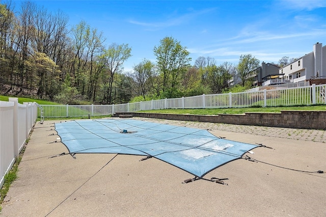 view of swimming pool with a fenced backyard, a fenced in pool, and a patio area