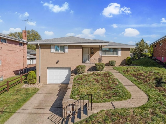 ranch-style home featuring fence, driveway, a front yard, and a garage