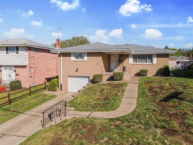 view of front of house with an attached garage, a front lawn, fence, and driveway