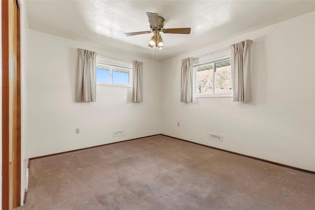 unfurnished room with baseboards, carpet, and ceiling fan
