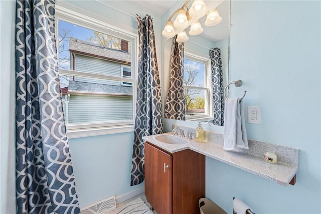 bathroom featuring visible vents and vanity