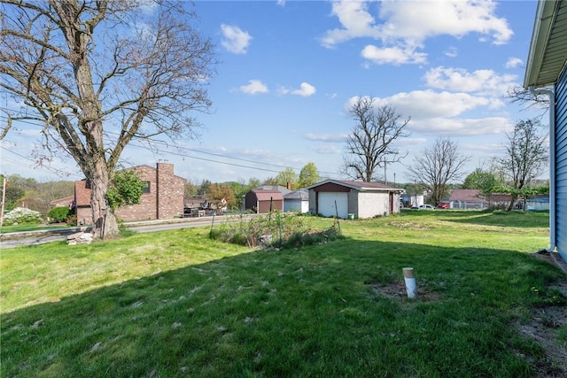 view of yard featuring a garage