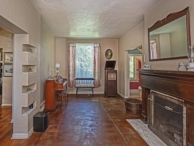 interior space featuring baseboards, baseboard heating, and wood-type flooring