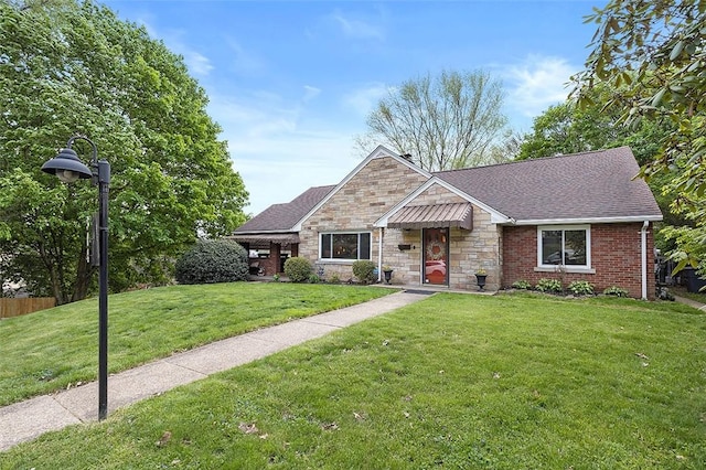 814 Clara St N, Versailles, PA 15137 - view of front of home with roof with shingles, fence, a front yard, and stone siding