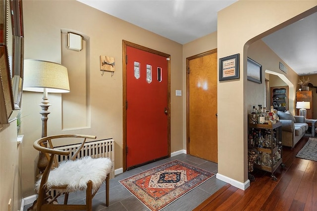 814 Clara St N, Versailles, PA 15137 - entrance foyer with arched walkways, baseboards, and wood finished floors