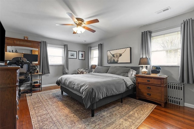 814 Clara St N, Versailles, PA 15137 - bedroom featuring radiator heating unit, baseboards, hardwood / wood-style flooring, and visible vents