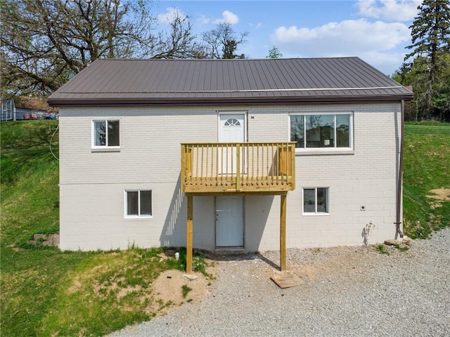 1460 Guffey Rd, North Huntingdon, PA 15642 - rear view of house featuring brick siding and a deck