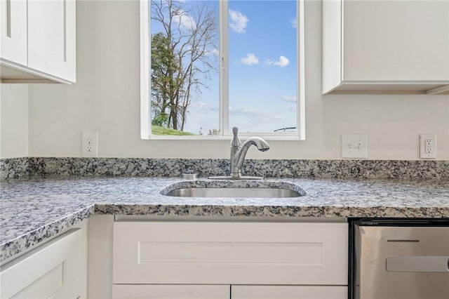 1460 Guffey Rd, North Huntingdon, PA 15642 - kitchen with a sink, white cabinets, light stone countertops, and fridge