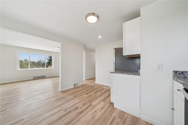 1460 Guffey Rd, North Huntingdon, PA 15642 - kitchen with visible vents, light wood-style floors, and white cabinets