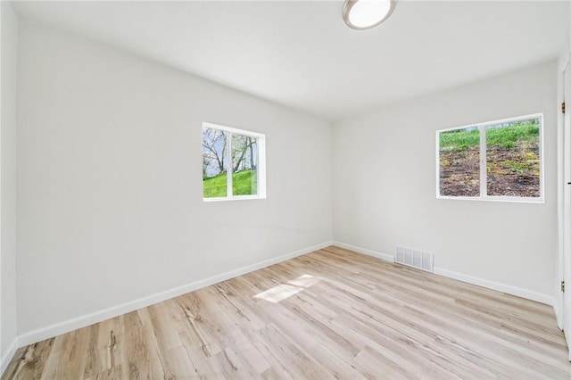 1460 Guffey Rd, North Huntingdon, PA 15642 - empty room with visible vents, light wood-style floors, and baseboards