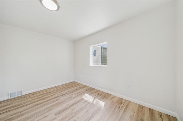 1460 Guffey Rd, North Huntingdon, PA 15642 - spare room featuring baseboards, light wood finished floors, and visible vents