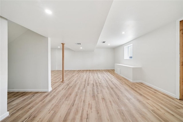 1460 Guffey Rd, North Huntingdon, PA 15642 - below grade area featuring baseboards, light wood finished floors, and visible vents