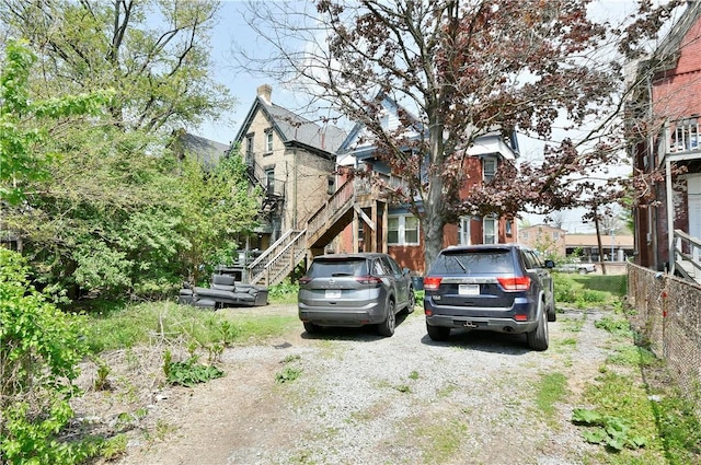 exterior space with stairway and fence