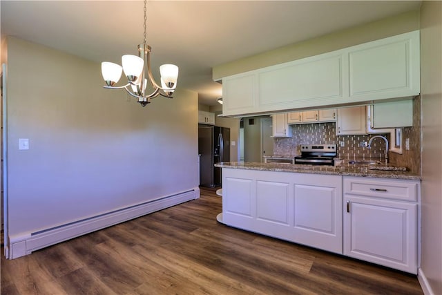 kitchen featuring stainless steel range with electric cooktop, a notable chandelier, black refrigerator with ice dispenser, a peninsula, and a baseboard radiator